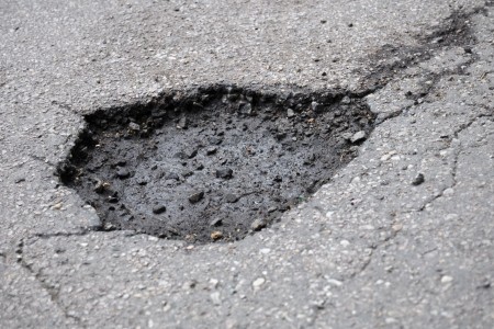 Daphne parking lot maintenance how to repair potholes and cracks before the summer heat